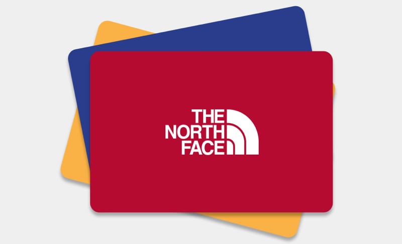 Three colorful gift cards from The North Face on a white background.