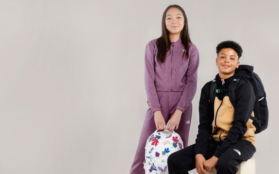  Studio shot of two teens wearing matching sets from The North Face.