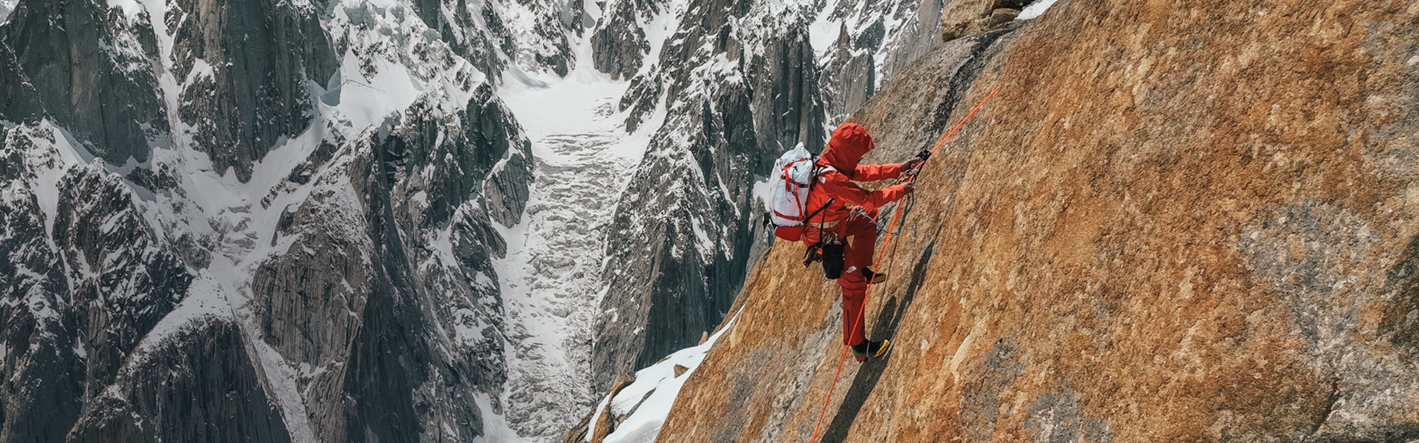 A woman winter climbs in Summit Series gear from The North Face.