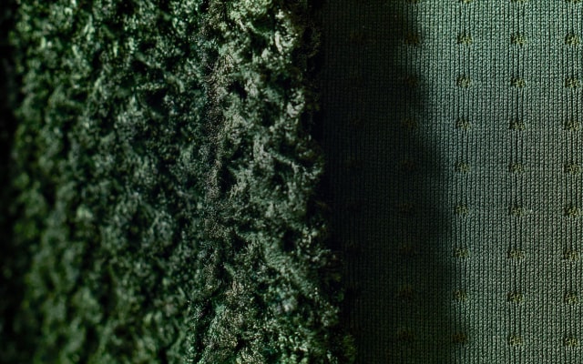 Close up image showing the texture of FUTUREFLEECE™ fabric from The North Face in pine needle green.