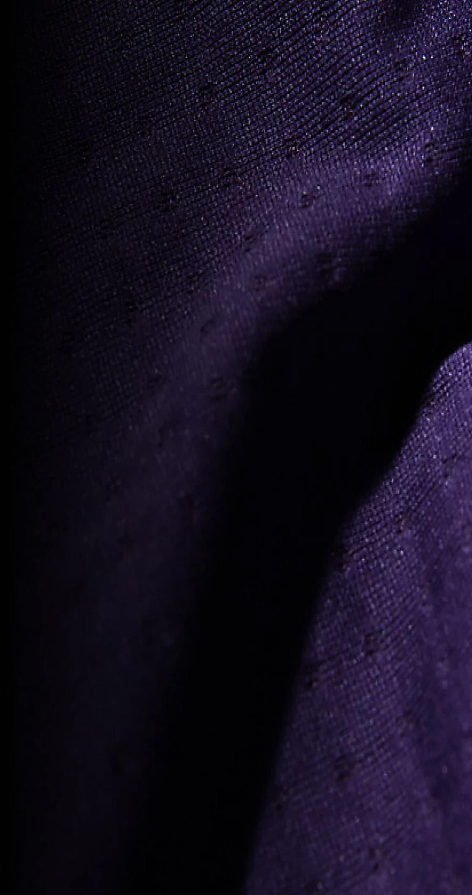 An extreme close-up of purple DotKnit fabric. 