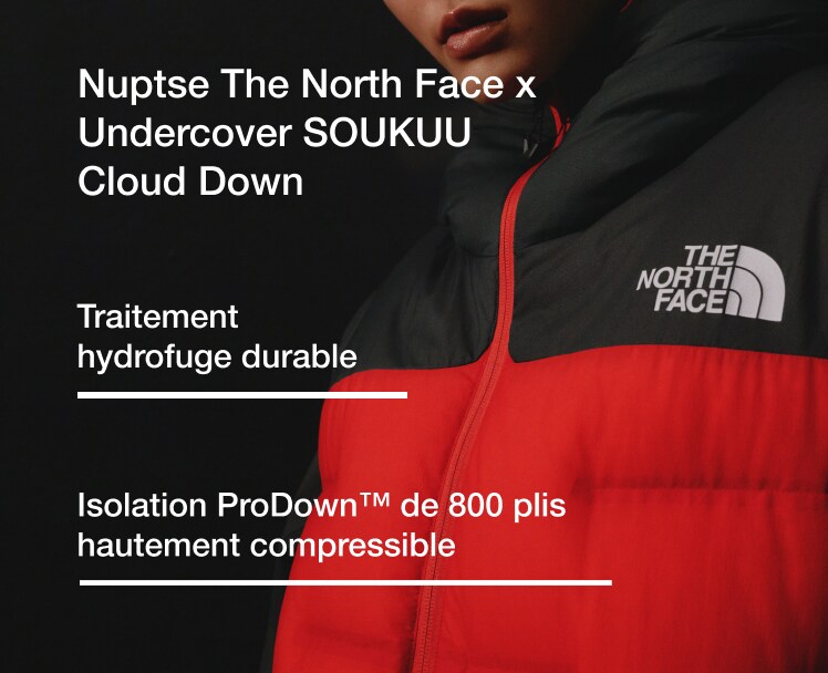 Une personne portant Nuptse The North Face x Undercover SOUKUU Cloud Down
