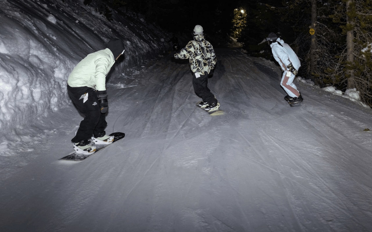 Three snowboarders ride at night in a new freeride collection from The North Face.
