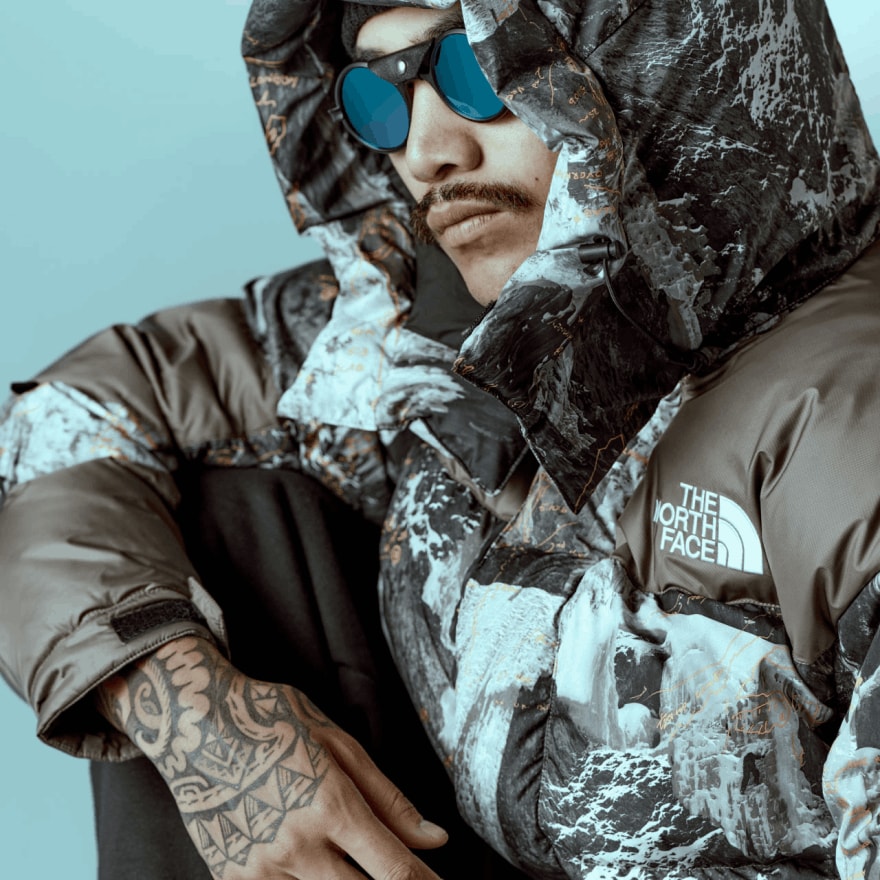 A close-up of a person wearing the HMLYN Baltoro Jacket from Conrad Anker’s Notes Collection.