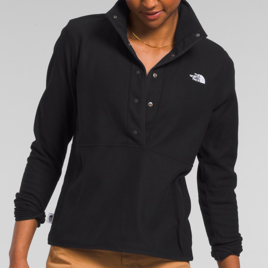  Studio shot of a woman in a black fleece from The North Face. 