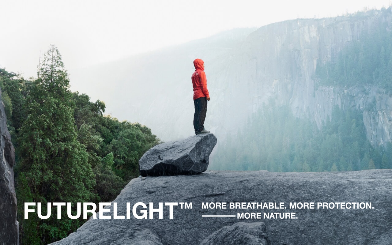 The North Face Athlete Emily Harrington admires the view from a ledge while wearing the FUTURELIGHT™ Papsura Jacket.  