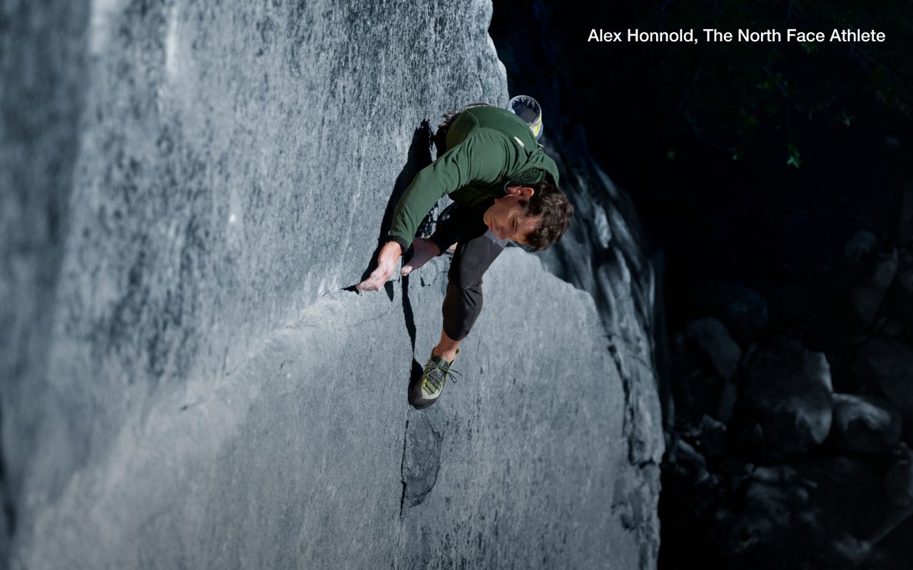 Athlete Alex Honnold is crack climbing wearing gear from The North Face. Text says: “Dare to go steep.”