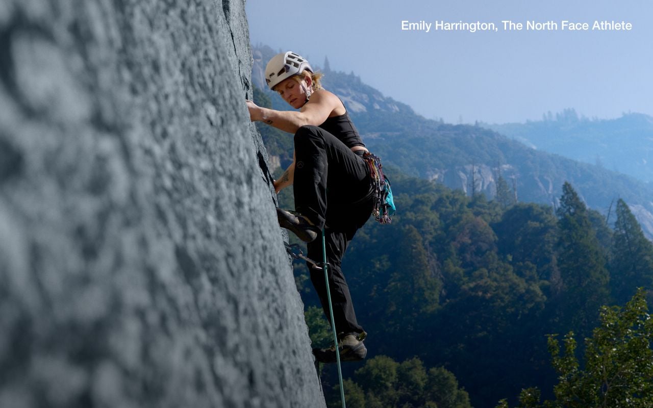 Athlete Emily Harrington is sport climbing wearing gear from The North Face. Text says: “But first, beta.” 