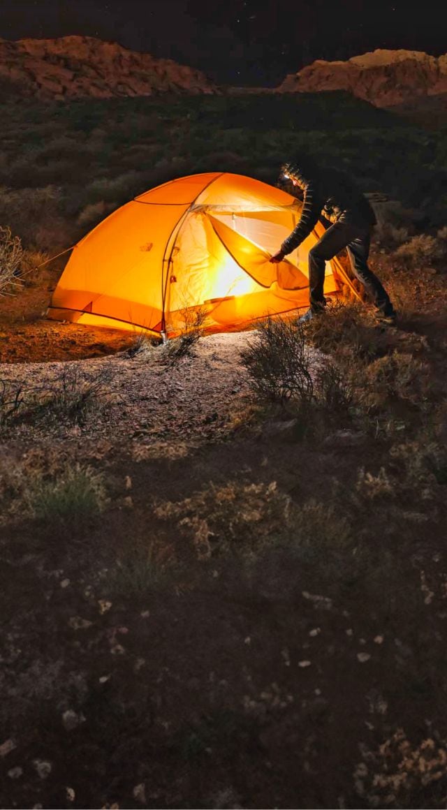 A tent from The North Face against a night sky.
