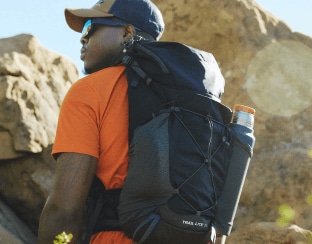 A man facing away from the camera with a backpack from The North Face.