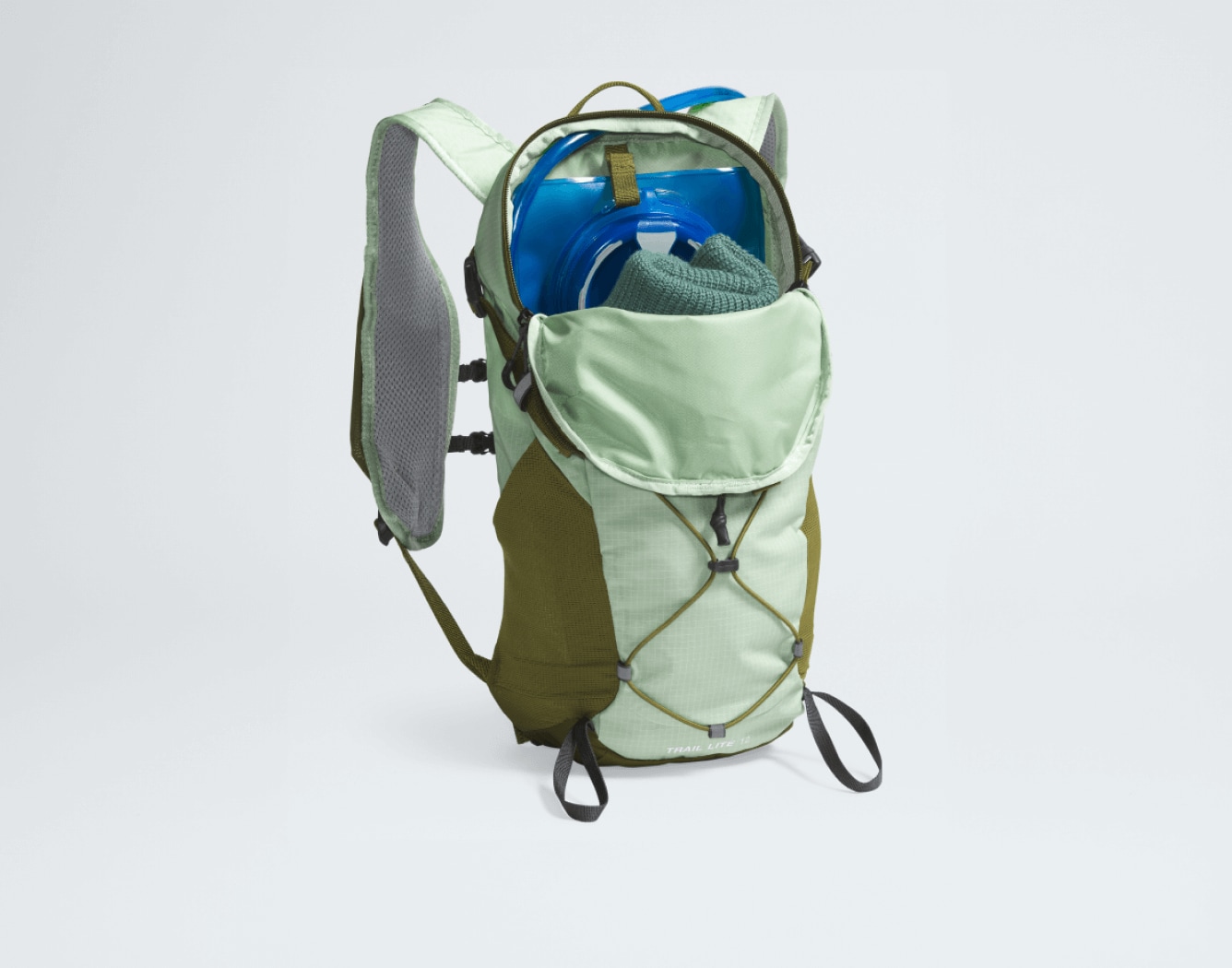 An image of The Trail Lite 12 Backpack. Text reads: “Enough room for everything the day holds.” 