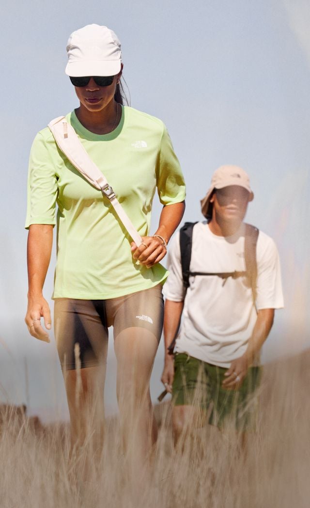 Split image of two distant hikers in a desert landscape, and a close-up of them hiking towards the camera. 